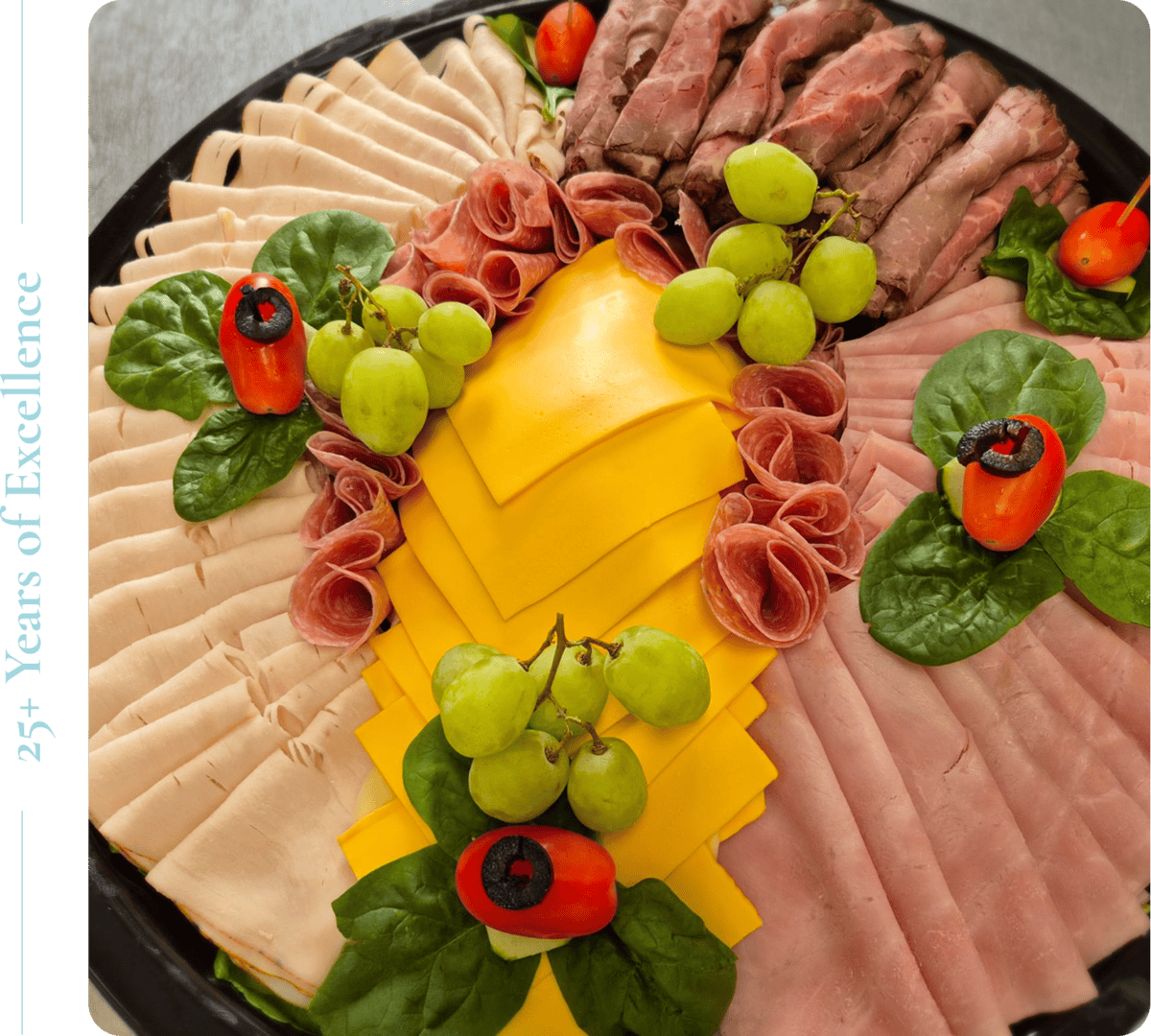 Gourmet platter with meats, cheese, and garnish