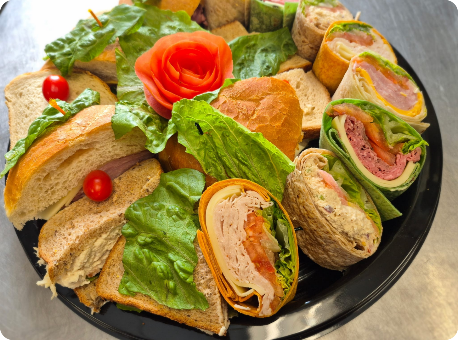 Platter of sandwiches with leafy greens