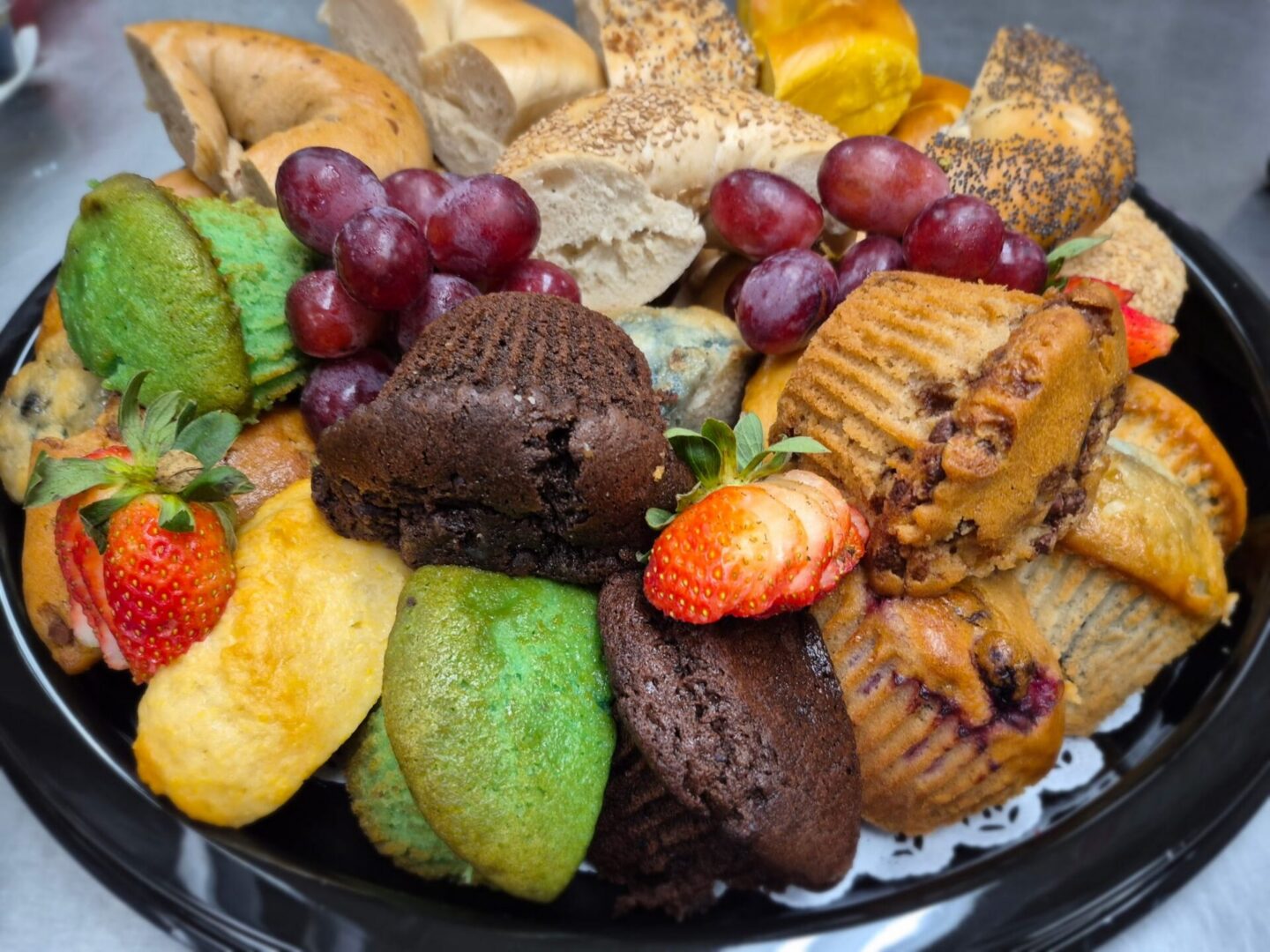 Mixed baked goods and fresh fruit display