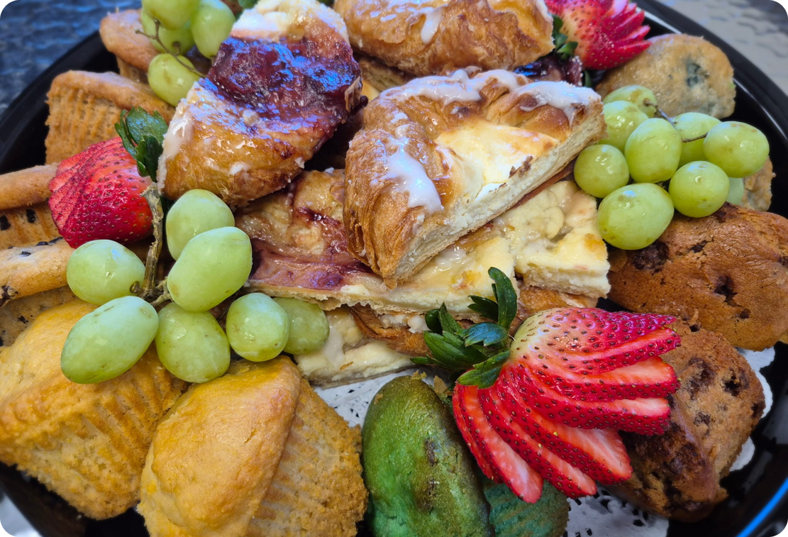 Pastry platter with grapes and strawberries