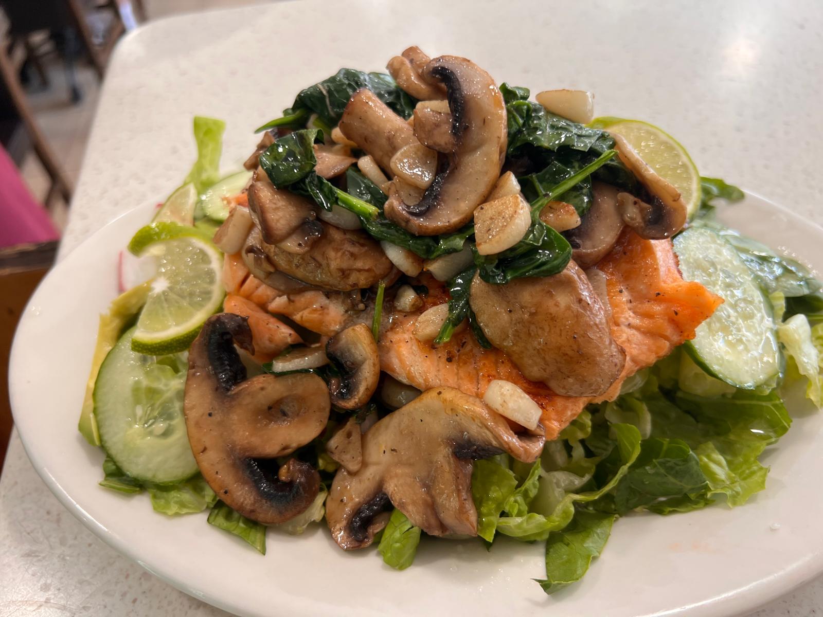 Healthy salmon dish with lime and spinach