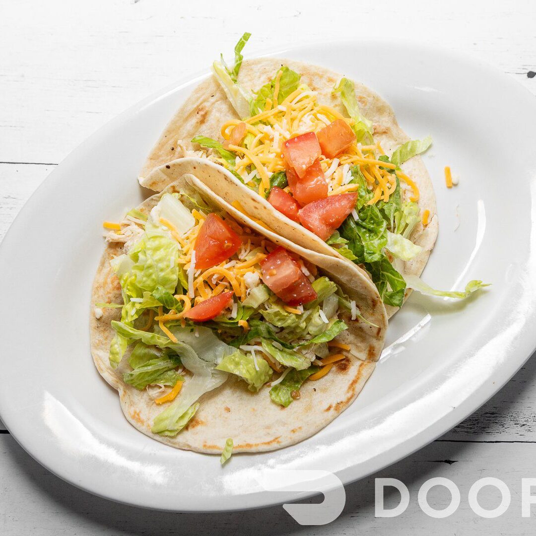 Fresh tacos on white plate